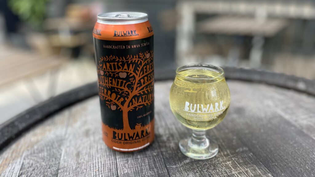 Bulwark Original can by glass filled with cider